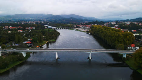 Stunning-aerial-4K-drone-footage-of-a-transportation-bridge-filmed-in-the-village-of-Ponte-de-Lima,-Portugal