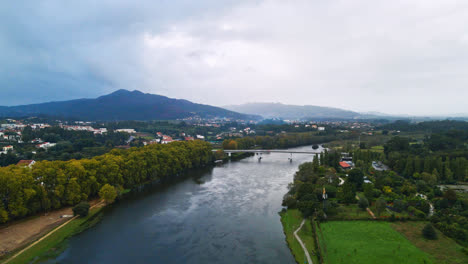 Stunning-aerial-4K-drone-footage-of-a-Ponte-de-Lima-and-its-river-the-Lima-River-in-Portugal