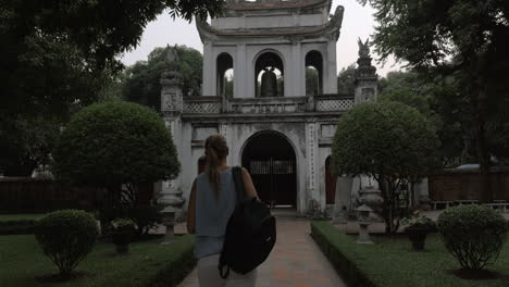 Tourist-shooting-Temple-of-Literature-main-gate-Hanoi-Vietnam