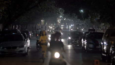 Motorbikes-and-cars-in-night-Hanoi-Vietnam
