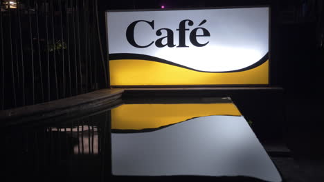Illuminated-cafe-banner-at-night