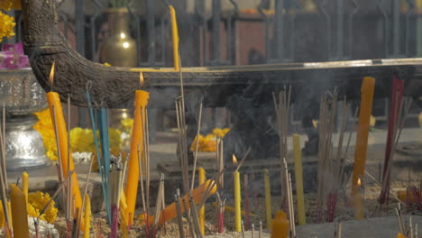 Burning-incense-and-candles-in-Bangkok-Thailand