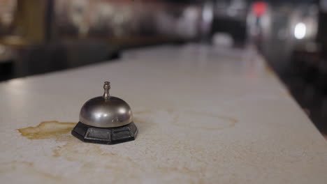Woman-rings-a-call-bell-multiple-times-at-an-old-diner