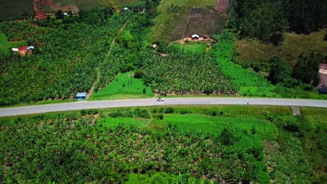 Jeep-Driving-Through-The-Road-Between-The-Banana-Plantation-In-Africa