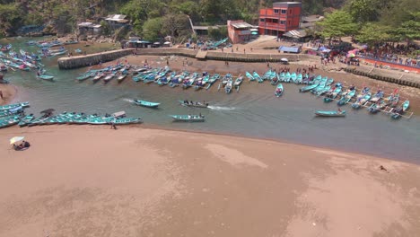 Aerial-view-of-moving-fishing-boats-on-the-harbor