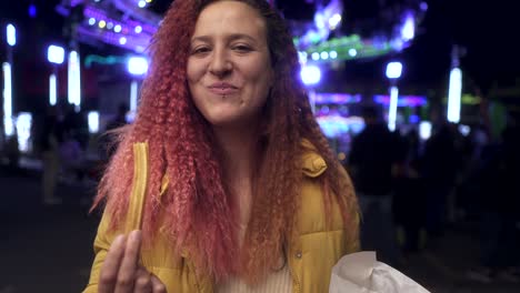 woman-eating-churros-at-the-fair-at-night