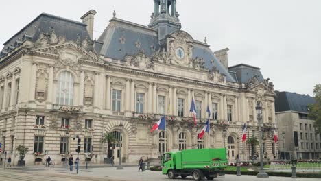 French-national-flags-flying-on-the-front-of-city-hall-building-in-Tours
