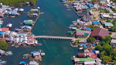 Aerial-drone-footage-from-above-of-Day-Asan-Floating-Village-in-Surigao-Del-Norte,-Philippines