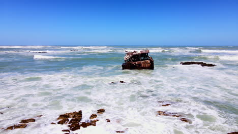 Iconic-Meisho-Maru-rusted-shipwreck-on-coastline-of-Cape-L'Agulhas,-aerial