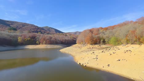 Swamp,-dam-in-Spain-without-water-Colorful-autumn-in-the-mountain-forest-ocher-colors-red-oranges-and-yellows-dry-leaves-beautiful-images-nature-without-people
