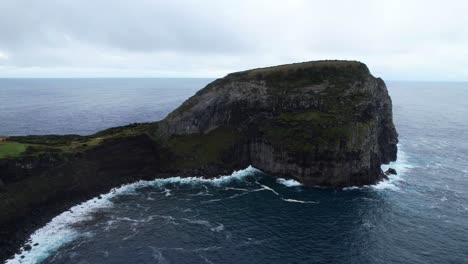 Aerial-static-shot-of-Morro-do-Castelo-Branco-with-its-white-cliffs,-Faial,-Azores
