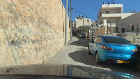 POV-Driving-through-tight-narrow-back-roads-in-Jerusalem,-Israel