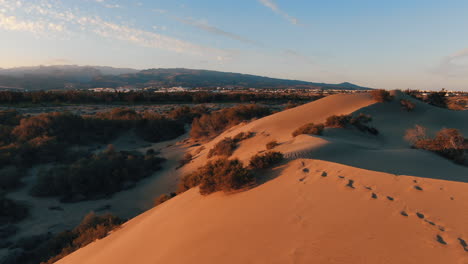 Flying-over-the-golden-dunes-of-Maspalomas-during-sunset
