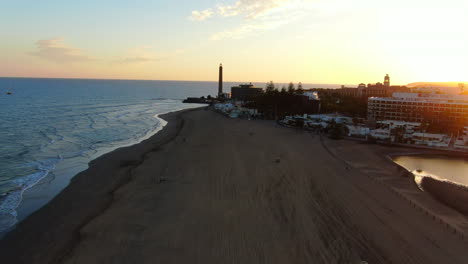 Flying-over-Maspalomas-beach-during-the-sunset-and-seeing-the-Maspalomas-Lighthouse