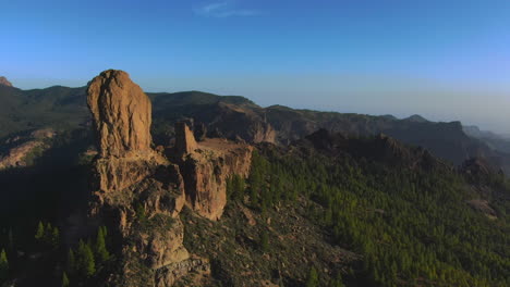 Bird's-eye-View:-Roque-Nublo-adorned-in-colors-at-sunset-in-Gran-Canaria