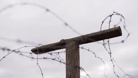 Barbed-wire-on-the-pole-against-the-sky---slow-motion