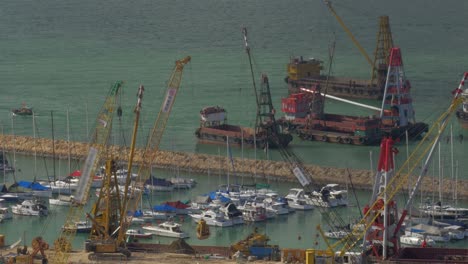 Aerial-view-of-dock-when-contained-barge-with-sand-by-crane-Hong-Kong-China
