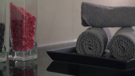 Close-up-view-of-woman-hand-putting-on-plate-rolls-of-towels