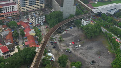 Daytime-panorama-of-city-Kuala-Lumpur-Malaysia-with-railway-with-a-passing-train
