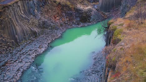 Turquoise-river-water-in-Studlagil-canyon-with-basalt-rock-pillars