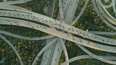 Major-intersection-Interstate-Freeway-I10-and-I610-in-Houston-Texas,-drone-ascend