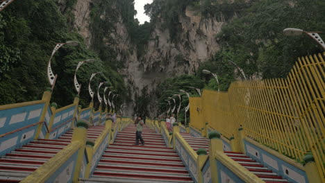 In-Batu-Caves-seen-long-stairs-and-mountain-with-greenery