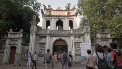 People-at-the-Temple-of-Literature-main-gate-in-Hanoi-Vietnam