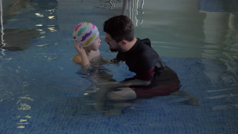 Rehabilitation-Centre-Evexia-small-boy-and-teacher-in-swimming-pool