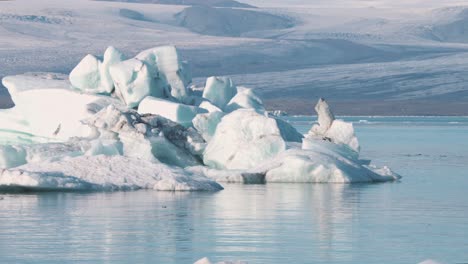 Frozen-arctic-sea-lagoon-glacier-panorama-with-icebergs-and-floes