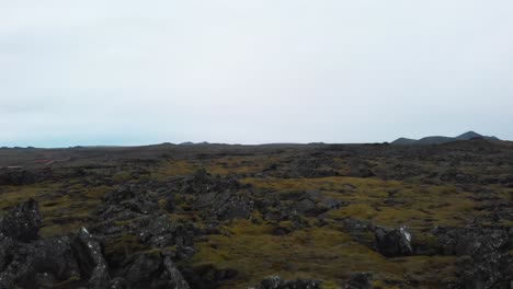 Lava-formations-in-mossy-heath-landscape,-Reykjanesfólkvangur-reserve
