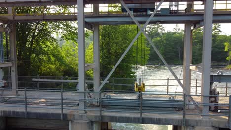 Aerial-footage-of-floodgate-controlling-flow-in-river,-flood-prevention