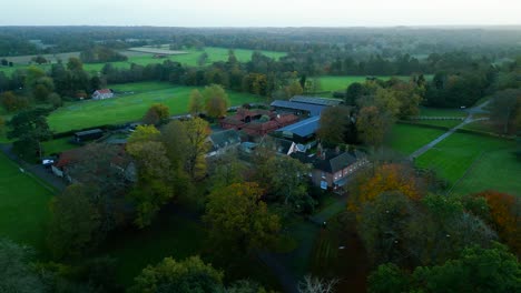 Strafing-aerial-drone-shot-of-a-beautifully-scenic-farmhouse-in-a-picturesque-farmstead-in-a-countryside-in-the-outskirts-of-Thetford-in-Great-Britain