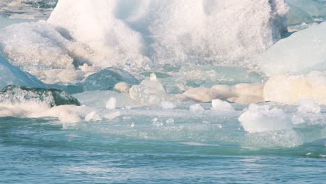Floating-ice-floes-and-icebergs-drifting-in-strong-sea-water-current