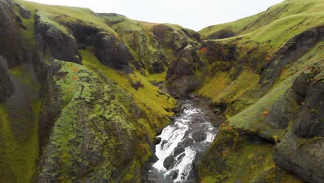 Rocky-gorge-with-moss-and-lichen-leading-to-Stjornarfoss-waterfall