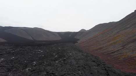 Steaming-black-lava-field-in-Fagradalsfjall-volcano-crater,-Iceland