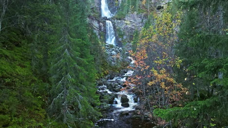 Rising-On-Cascades-In-Rocky-River-Mountains-During-Autumn-In-Sweden