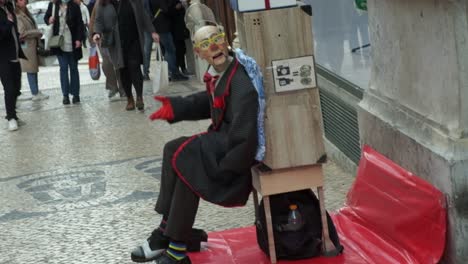 Lisbon,-street-performer-playing-to-the-camera-and-passers-by
