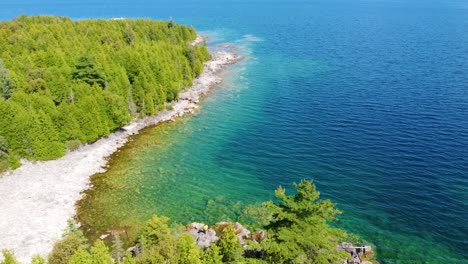 Panoramic-aerial-view-of-the-dense-forests-on-the-shores-of-Georgian-bay,-Canada