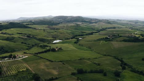 Wide-aerial-view-overlooking-Italy's-rural-farmland