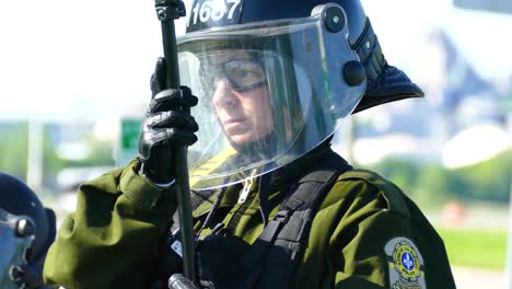 Surety-of-Quebec-Female-Police-Officer-In-Riot-Gear-During-G7-Summit-Protest-In-Quebec,-Canada