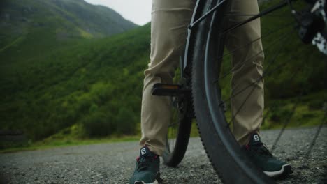 Slow-motion-mid-shot-of-cyclists-foot-moving-onto-pedal