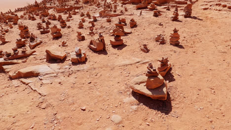 Homogenous-pattern-of-stacked-rocks-spread-across-as-mementos-from-tourists-visiting-Wadi-Rum