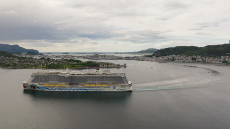 Cruise-ship-the-AidaNova-sailing-at-the-Port-of-Aalesund,-Norway