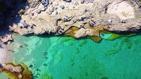 Overhead-aerial-drone-shot-over-Georgian-Bay,-a-hidden-gem-with-its-crystal-clear-waters-a-part-of-Lake-Huron-in-Ontario,-Canada