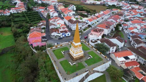 Aerial-360-orbit-around-Obelisco-do-Alto-da-Memoria-in-Ilha-Terceira,-Azores