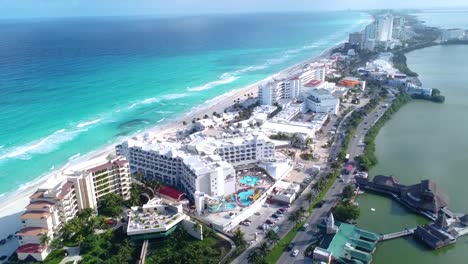 Stunning-aerial-view-of-Cancun-hotel-zone-between-blue-Caribbean-Sea-and-Nichupté-Lagoon,-Mexico