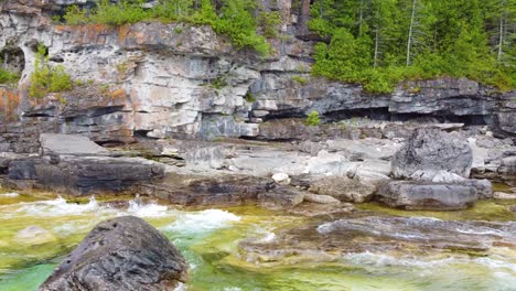 Waves-Crashing-On-Granite-Stone-Walls-At-Flowerpot-Island-In-Georgian-Bay,-Ontario-Canada