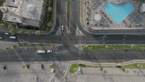 Aerial-static-video-of-an-intersection-by-the-coast-in-Tel-Aviv,-Israel