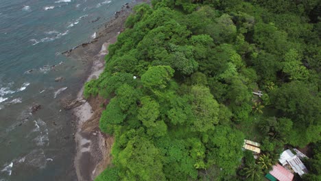 Lush-Green-Rainforest-Coast-With-Ocean-Waves,-Costa-Rica-Drone-Flyover