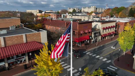 American-flag-waving-in-downtown-Blacksburg,-Virginia